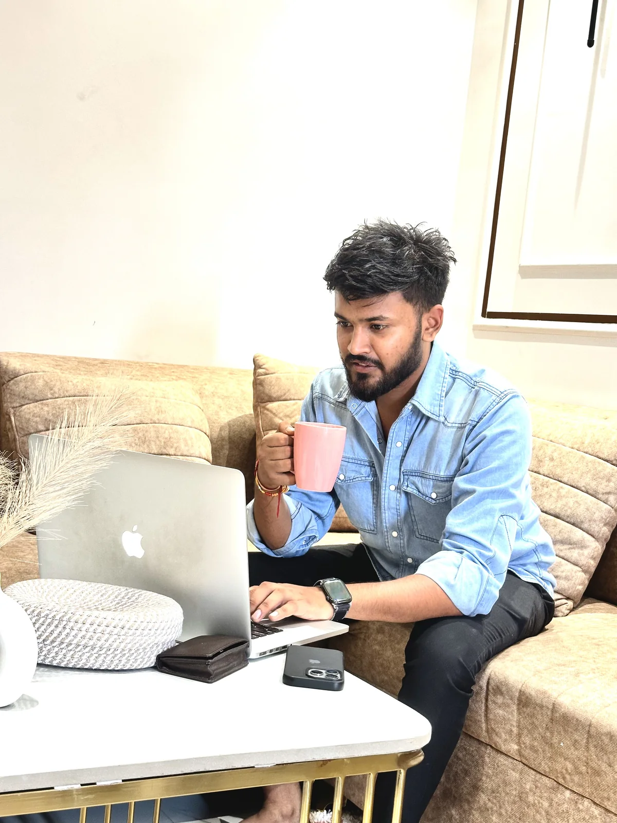 Adarsh Umrao working on AI products from his laptop